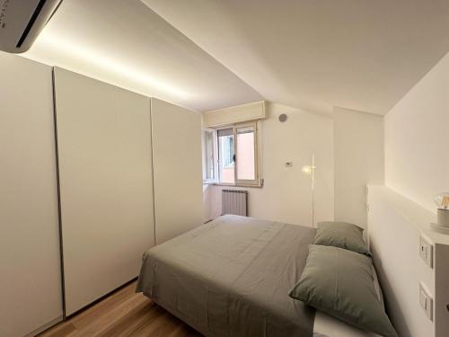 Ένα ή περισσότερα κρεβάτια σε δωμάτιο στο Residence Via Foscolo 65 Cattolica RN