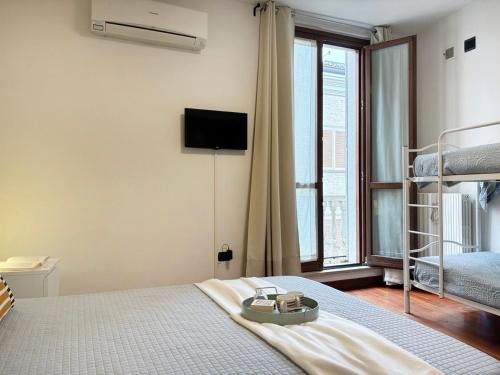 Ένα ή περισσότερα κρεβάτια σε δωμάτιο στο Holihome - La Suite dei Fiori