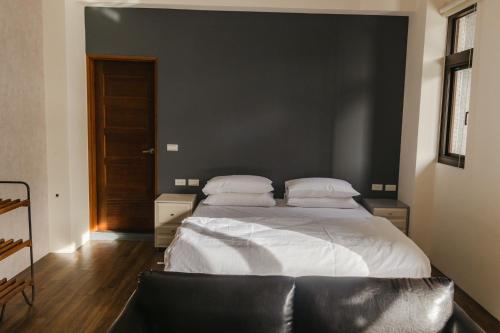 Postel nebo postele na pokoji v ubytování Lai Dua 賴著住一晚