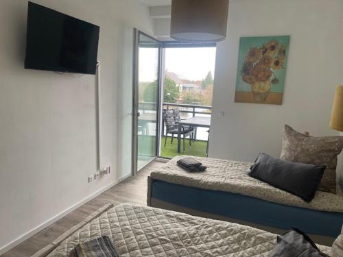 Μια τηλεόραση ή/και κέντρο ψυχαγωγίας στο Studio-Apartment Hohe Börde