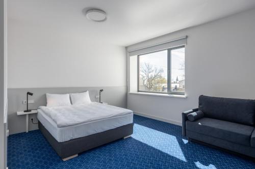 Roze Kurmajas Hotelにあるベッド