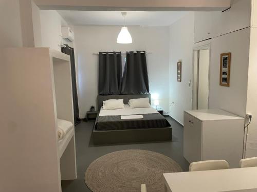 Postel nebo postele na pokoji v ubytování Spanos Apartments - Panteli