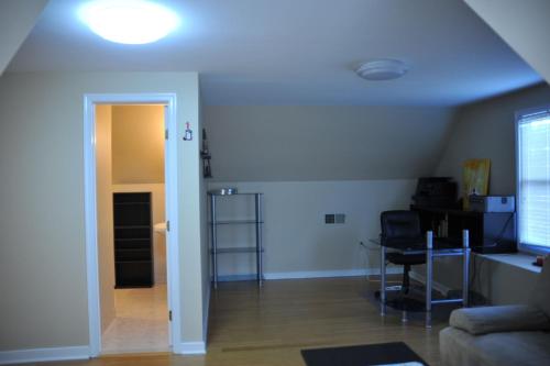 a living room with a couch and a table at The Deluxe Oasis in the north west suburbs of Richmond Zip 23060 in Glen Allen