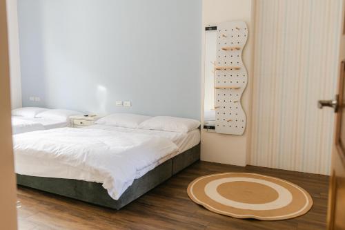 Postel nebo postele na pokoji v ubytování Lai Dua 賴著住一晚