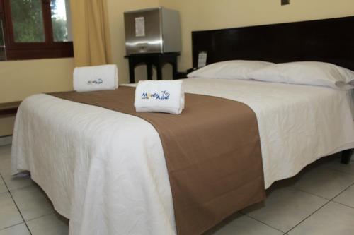 Postel nebo postele na pokoji v ubytování Hotel Monte Azul