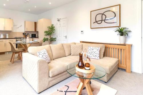 a living room with a couch and a table at Balfour House in Etruria