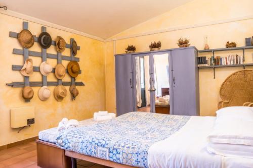 a bedroom with a bed and some pots and pans at Fattoria dei Piani srl in Olmedo