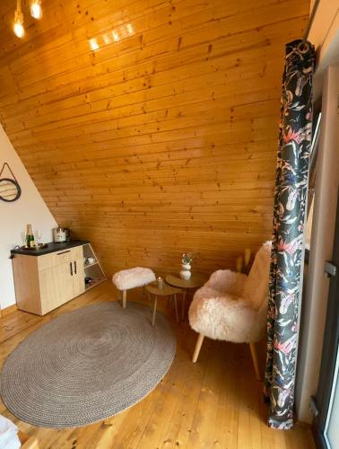 a room with a table and two chairs in a room at A FRAME 1 TRANSALPINA in Petreşti