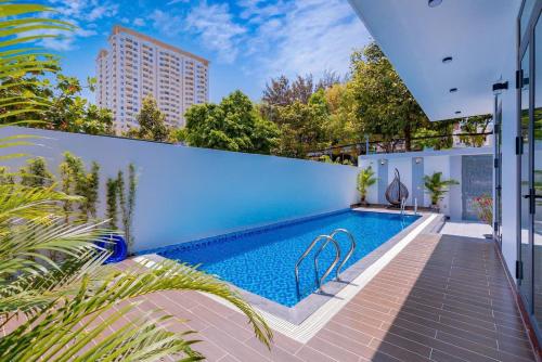 a swimming pool in the backyard of a house at Minh Phuoc Villa Crystal in Vung Tau
