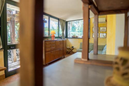 a room with a dresser with a lamp on it at Fattoria dei Piani srl in Olmedo