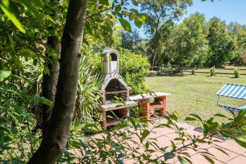 a playground in a park with a bench at Fattoria dei Piani srl in Olmedo