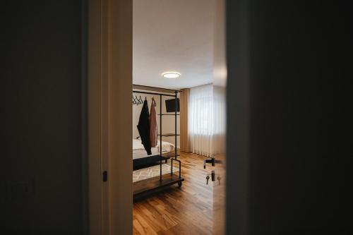 a room with a bed and a painting on the wall at Acasa la Pojorata in Pojorîta