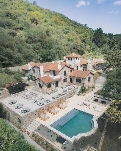 an aerial view of a house with a swimming pool at Casa Toledo in La Cumbre