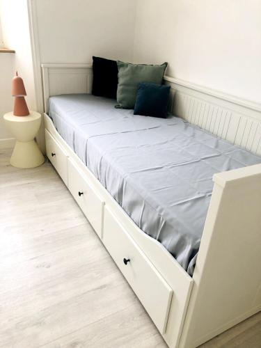 Ένα ή περισσότερα κρεβάτια σε δωμάτιο στο Appartement familial lumineux à 100m de la plage