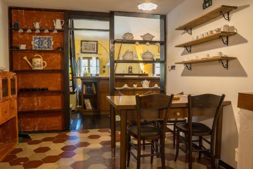 a kitchen with a table and chairs in a room at Fattoria dei Piani srl in Olmedo