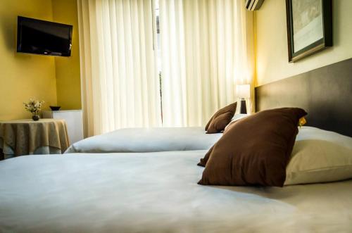Postel nebo postele na pokoji v ubytování Gran Bolivar Hotel - Trujillo, Perú