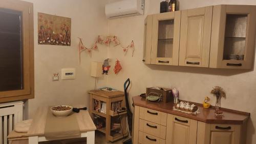 a kitchen with a counter and a table in it at Private house in Baone