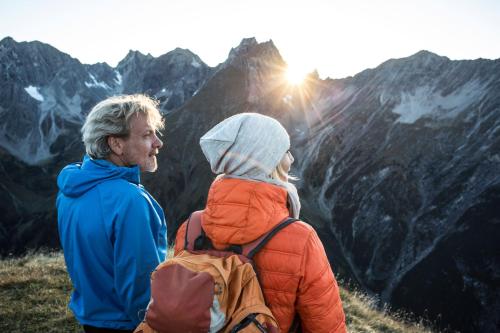a man and a woman standing on top of a mountain at Europa Pension Tirol in Fliess
