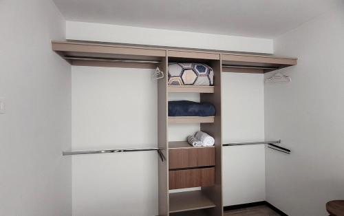 a walk in closet with two sliding doors at Take a rest nearest to Antigua Guatemala in Santa Lucía Milpas Altas