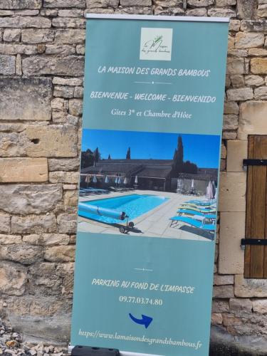 a sign for a swimming pool at a resort at La Maison des Grands Bambous - L'Angoumois L'Aunis La Saintonge La Boutonne in Louzignac