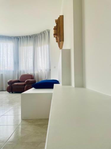 a living room with a table and a couch at Studiò in Termoli