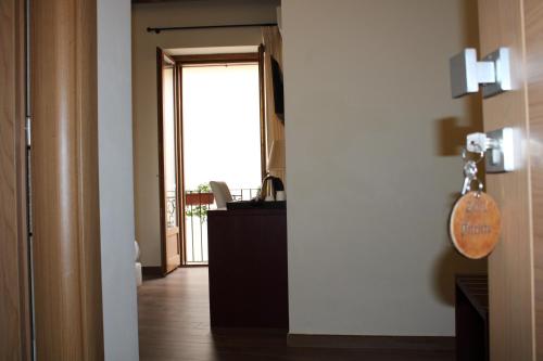 a hallway with a door leading to a room at Il Borgo Ospitale - Albergo Diffuso in Rotonda