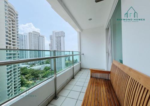 a balcony with a bench and a view of the city at Gurney Drive Mansion One Serviced Apartment in George Town