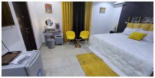Ένα ή περισσότερα κρεβάτια σε δωμάτιο στο NDDC Clubhouse