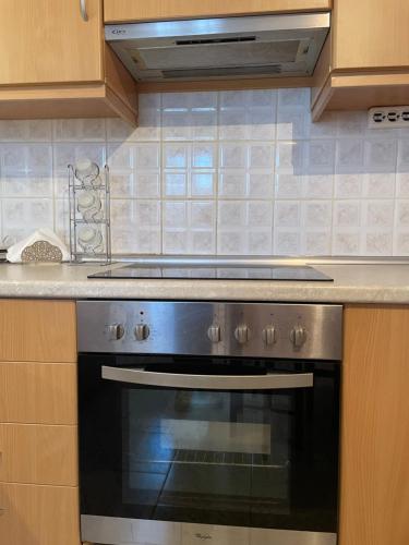 a stove top oven in a kitchen at Kymi's apartment in Kymi
