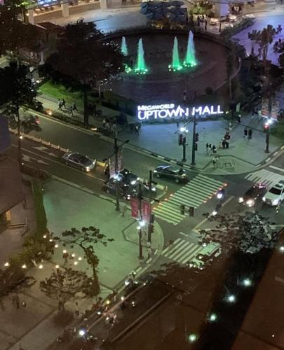 an aerial view of a city with a fountain at night at Mystay-25T at PARKSUITES TOWER1 in Sampong
