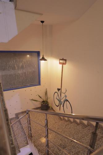 a bike leaning against a wall in a room at AmigosIndia in New Delhi