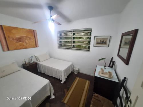 Postel nebo postele na pokoji v ubytování Cosme Velho - Rooms CORCOVADO STATION