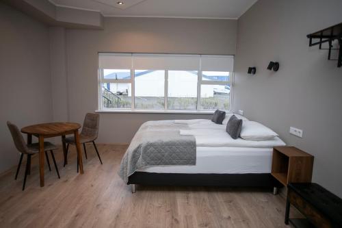 Postel nebo postele na pokoji v ubytování Skýjaborg Apartments