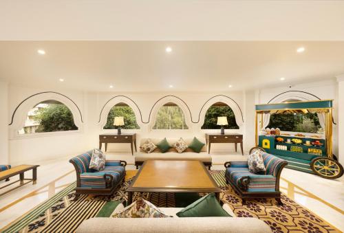 a living room with a couch and a table at Gateway Aurangabad - Chhatrapati Sambhaji Nagar in Aurangabad