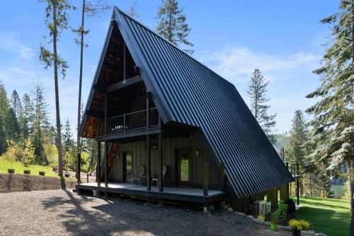 a house with a metal roof at The CDA-frame - Lake Views with Boat Slip in Coeur d'Alene