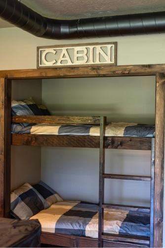a couple of bunk beds in a room at The CDA-frame - Lake Views with Boat Slip in Coeur d'Alene