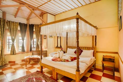 Ein Bett oder Betten in einem Zimmer der Unterkunft Leela Cottages
