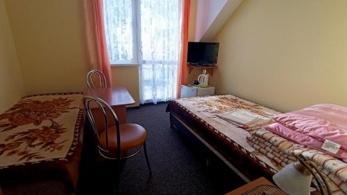 Postel nebo postele na pokoji v ubytování Delfin -przy plaży, widok na morze