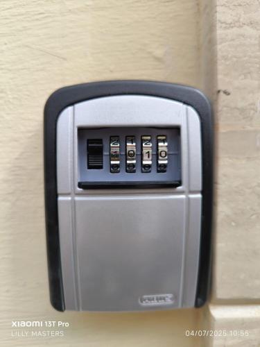 a microwave oven is attached to a wall at Theo's Court Sea View in Marsalforn