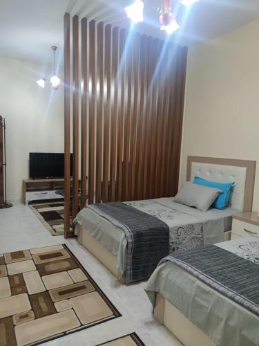 Ένα ή περισσότερα κρεβάτια σε δωμάτιο στο Ami guest house
