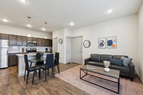 a living room with a couch and a table at Chisholm Trace 734 I Spacious 1 Bed 1 Bath in Cleburne