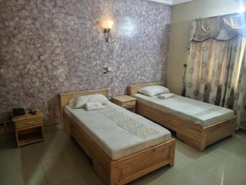 Postel nebo postele na pokoji v ubytování Bois vert Hôtel