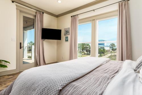 En eller flere senge i et værelse på The Periwinkle New Listing Spring/Summer Availability!