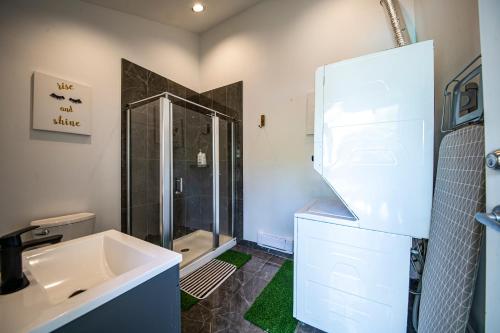 a bathroom with a sink and a shower at Seymour Private Bedroom, Ensuite Bathroom with Shared Pool, Hot Tub with Views in North Vancouver