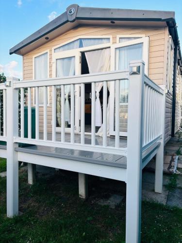 a screened in porch on a tiny house at Haven Holiday Park, Kent Coast in Allhallows