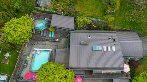 an overhead view of a house with a swimming pool at The Lions Self Contained Suite, Shared Pool, Hot Tub, Views in North Vancouver