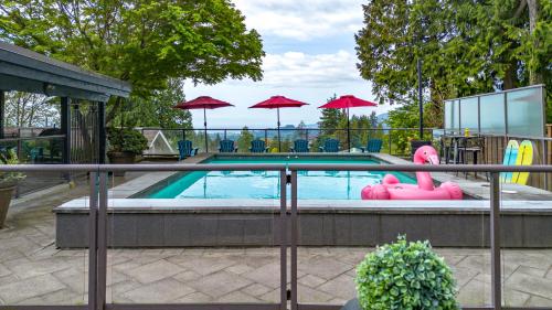 a swimming pool with a pink inflatablelatable pool at The Lions Self Contained Suite, Shared Pool, Hot Tub, Views in North Vancouver