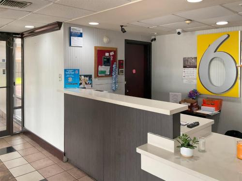 a waiting room with a counter in a hospital at Motel 6 Baton Rouge East, LA I12 in Baton Rouge