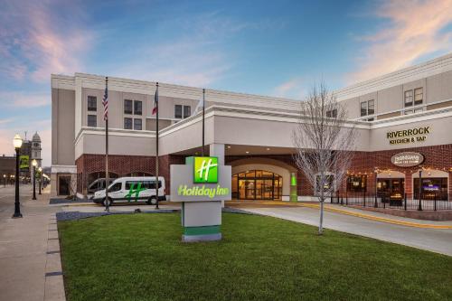 a hotel with a sign in front of a building at Holiday Inn Dubuque/Galena by IHG in Dubuque