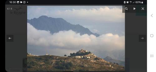 a picture of a house on top of a mountain at Superbe Maison de village authentique vue mer in SantʼAntonino
